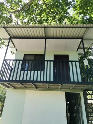 a balcony on the front of a house at Bee in Veintisiete de Abril