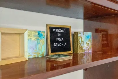 a shelf with a welcome to proractor sign on it at Pura Armonia Condo with Outdoor Patio in Coco