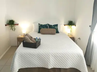 a bedroom with a large bed with a basket on it at Hotel Boutique CasAguacate Apt Morfo close to Airport in Potrerillos