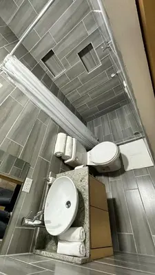 a bathroom with a toilet and a sink at Nomada Monteverde in Monteverde Costa Rica