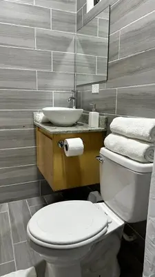 a bathroom with a white toilet and a sink at Nomada Monteverde in Monteverde Costa Rica