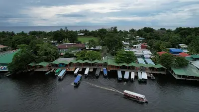 an aerial view of a resort on the water at Tortuguero7 lake view in Tortuguero