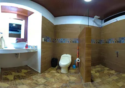 a bathroom with a toilet and a sink at Tortuguero7 lake view in Tortuguero