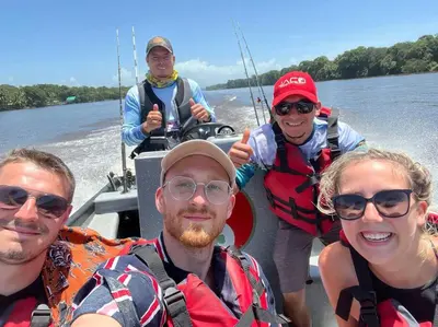a group of people on a boat on the water at Chilamate Room in Tortuguero