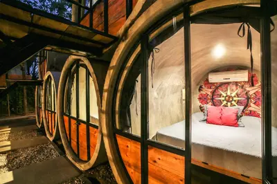 a room with a bed inside of a building at Pipe House Playa Grande in Playa Grande