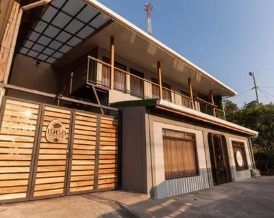 a building with a balcony on the side of it at 1968house in Monteverde Costa Rica