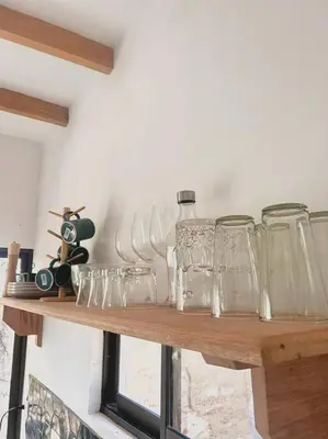 a wooden shelf with glasses on top of it at Cozy Cottage Hilltop near Conchal - Casa Vala in Matapalo