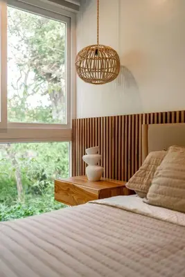 a bedroom with a bed and a large window at Hermosa Palms, Casa Lorenzo Beach Front Club House in Playa Hermosa