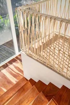 a room with a wooden floor and a balcony at Hermosa Palms, Casa Lorenzo Beach Front Club House in Playa Hermosa