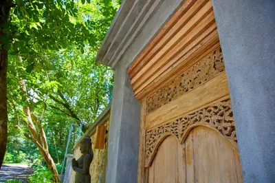 a wooden door on the side of a house at Casa Ananda a Bali Inspired Home in Nosara