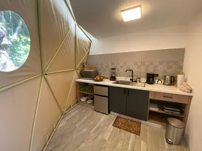 a small kitchen with a sink and a window at Way To Heaven Glamping in Monteverde Costa Rica
