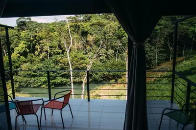 a view of a porch with a table and chairs at Cala-Ranch Suites - Dream in Quesada