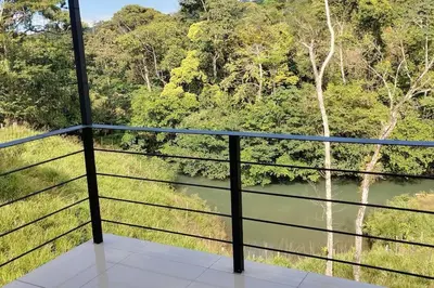 a balcony with a view of a river and trees at Cala-Ranch Suites - Dream in Quesada