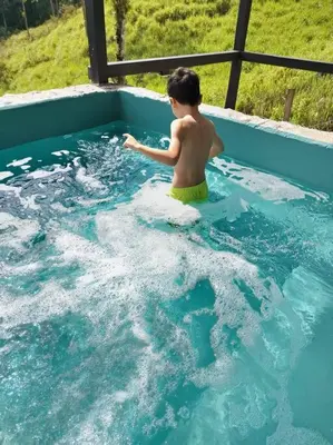 a young boy in a pool of water at Cala-Ranch Suites - Dream in Quesada
