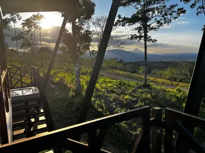 a view from the porch of a house with a view of the mountains at Villa ViVe in Florencia