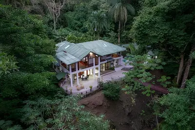 an aerial view of a house in the forest at The Jungle Inn in Dominicalito