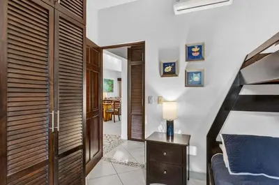 a bedroom with a bed and a table with a lamp at Roca Blanca -Private Pool- Near To Conchal & Flamingo Beach in Brasilito
