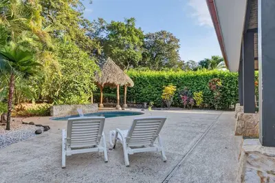 two chairs and a gazebo in a yard at Roca Blanca -Private Pool- Near To Conchal & Flamingo Beach in Brasilito