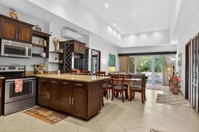 a kitchen with a table and a dining room at Roca Blanca -Private Pool- Near To Conchal & Flamingo Beach in Brasilito