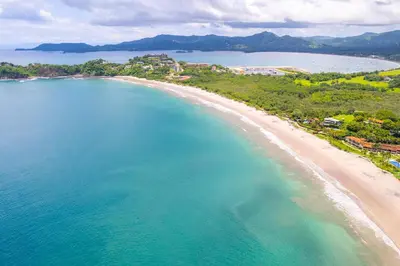 an aerial view of a beach and the ocean at Casa Mariposa - villa with infinity pool, near beach in Brasilito