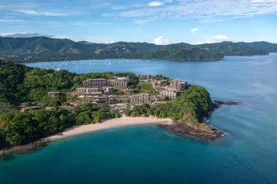 an island in the middle of a body of water at Waldorf Astoria Costa Rica Punta Cacique in Playa Hermosa