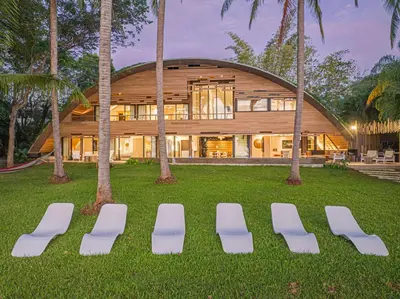a group of chairs in front of a house at Dream On Costa Rica in Santa Cruz