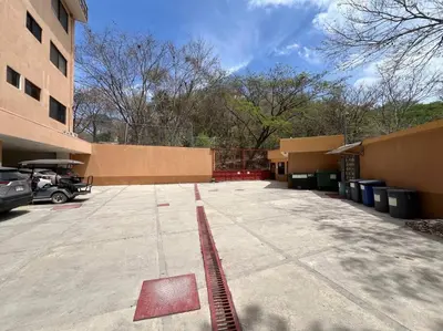 a parking lot in front of a building at Breathtaking Ocean View Condo in Sámara