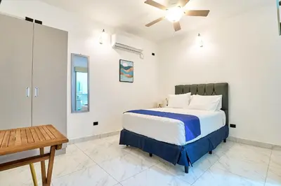 a bedroom with a bed and a ceiling fan at #5 Apartaestudio la capital in San José
