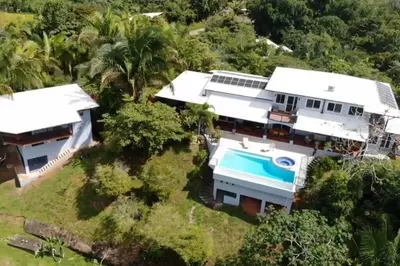 an aerial view of a house with a swimming pool at Luxury Villa with Separate Guest house and 360view in Quepos