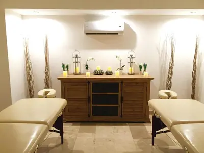 a waiting room with two chairs and a table at Oceano Boutique Hotel & Bistró in Jacó
