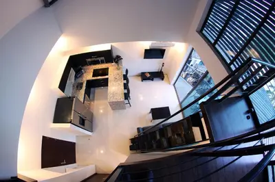 an overhead view of a building with a spiral staircase at Oceano Boutique Hotel & Bistró in Jacó