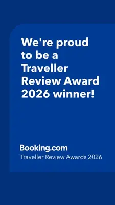 a blue sign that says were proud to be a traveller reviewagency winner at Casa Arthémis - Rainforest Lodge in Guápiles