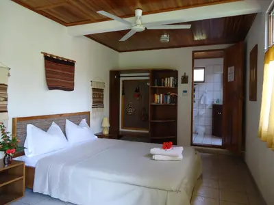 a bedroom with a large white bed in a room at Quinta Don Fernando in La Garita