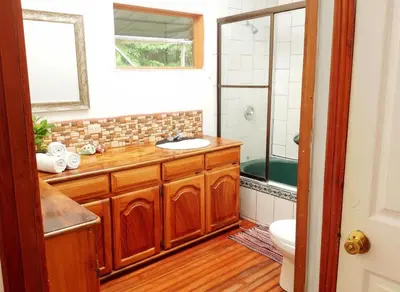a bathroom with a sink and a shower at Rainbow House in Monteverde Costa Rica