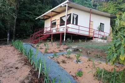 a house with a garden in front of it at Rainbow House in Monteverde Costa Rica