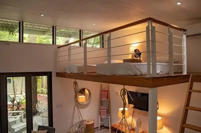 a bedroom with a bunk bed in a house at Oceano 5 - Walk to the beach in Playa Pelada
