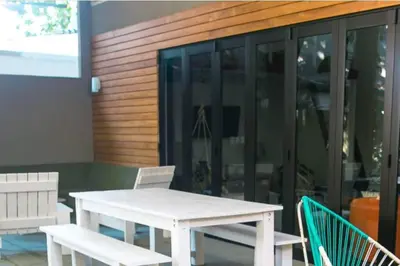 a white table and chairs in front of a building at Oceano 5 - Walk to the beach in Playa Pelada