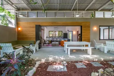 a living room with a table and chairs at Oceano 5 - Walk to the beach in Playa Pelada