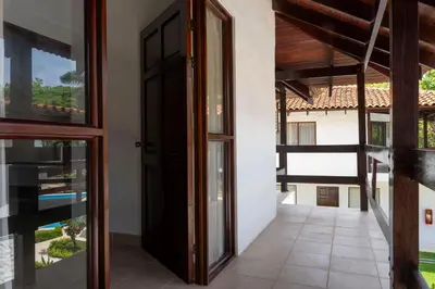 an open door to a room with a balcony at Fuego del Sol Beachfront Hotel in Jacó