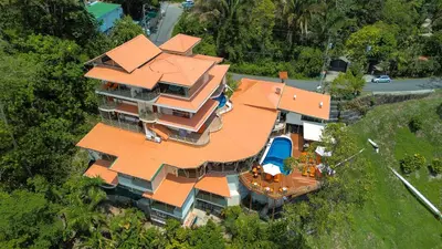 an overhead view of a large house with an orange roof at Issimo Suites (Adults Only) in Manuel Antonio