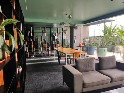 a living room with a couch and a table at CityScape Properties 20th floor Studio 24-7 Concierge Amenities in San José