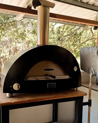 a pizza oven sitting on top of a table at Finca Aquarius in Monteverde Costa Rica