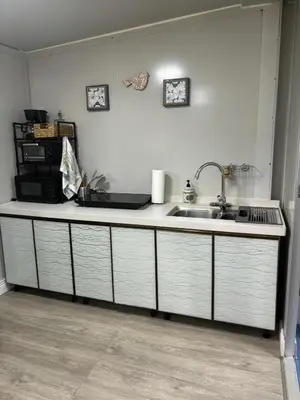 a kitchen with a sink and a counter top at Gaspar Arenal Volcano in Fortuna