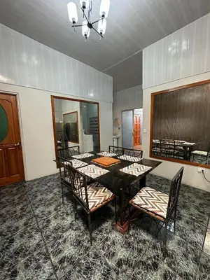 a dining room with a table and chairs at Casa Buen Agüero in San Antonio