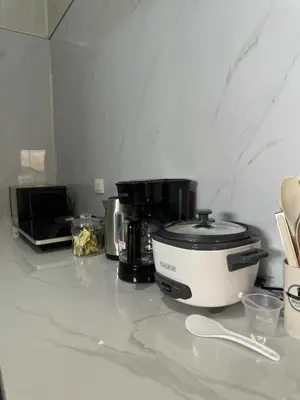 a kitchen counter with a toaster and a coffee maker at Casa Buen Agüero in San Antonio