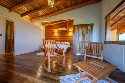 a living room with two chairs and a table at Two Volcanoes Villa Fortuna in Fortuna