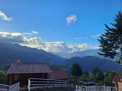 a barn with a view of a mountain at Cabaña Duende Oscuro - Paradise IN THE Mountains! in San Pablo