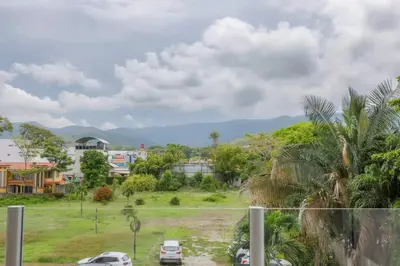 a view of a city with cars parked in a field at Diamante del Sol 303S- 3rd Floor Ocean View in Jacó