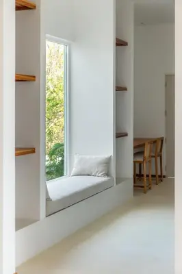 a window seat in a room with a table at Stylish ocean view Villa Blume at Hermosa Hills in Playa hermosa