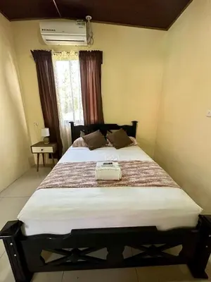 a bedroom with a large bed in a room at Beautiful View House in Tortuguero